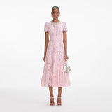 Front view of a woman wearing the Pink Lace Embellished Midi Dress